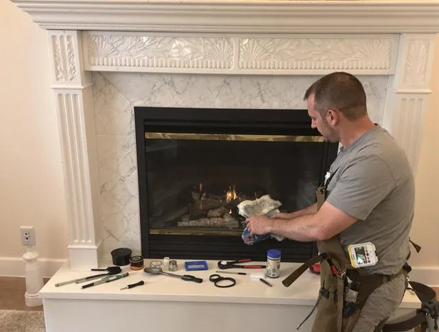 Seven Hills Chimney Sweep performing fireplace maintenance in Seven Hills, OH